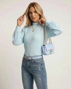 Celeste Blouse by Lauven, elegant white pleated long sleeve top styled with chic accessories.