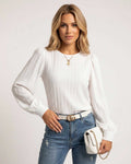 Celeste Blouse by Lauven - Elegant white pleated long sleeve top, perfect for a chic outfit.