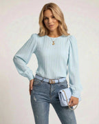 Celeste Blouse by Lauven in light blue with pleated long sleeves and stylish accessories.