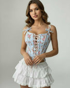 Celeste Corset Top by Lauven featuring blue floral design and lace-up front, elegantly structured and comfortable fit.