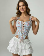 Celeste Corset Top by Lauven, blue floral lace-up design, structured silhouette, showcasing modern elegance.