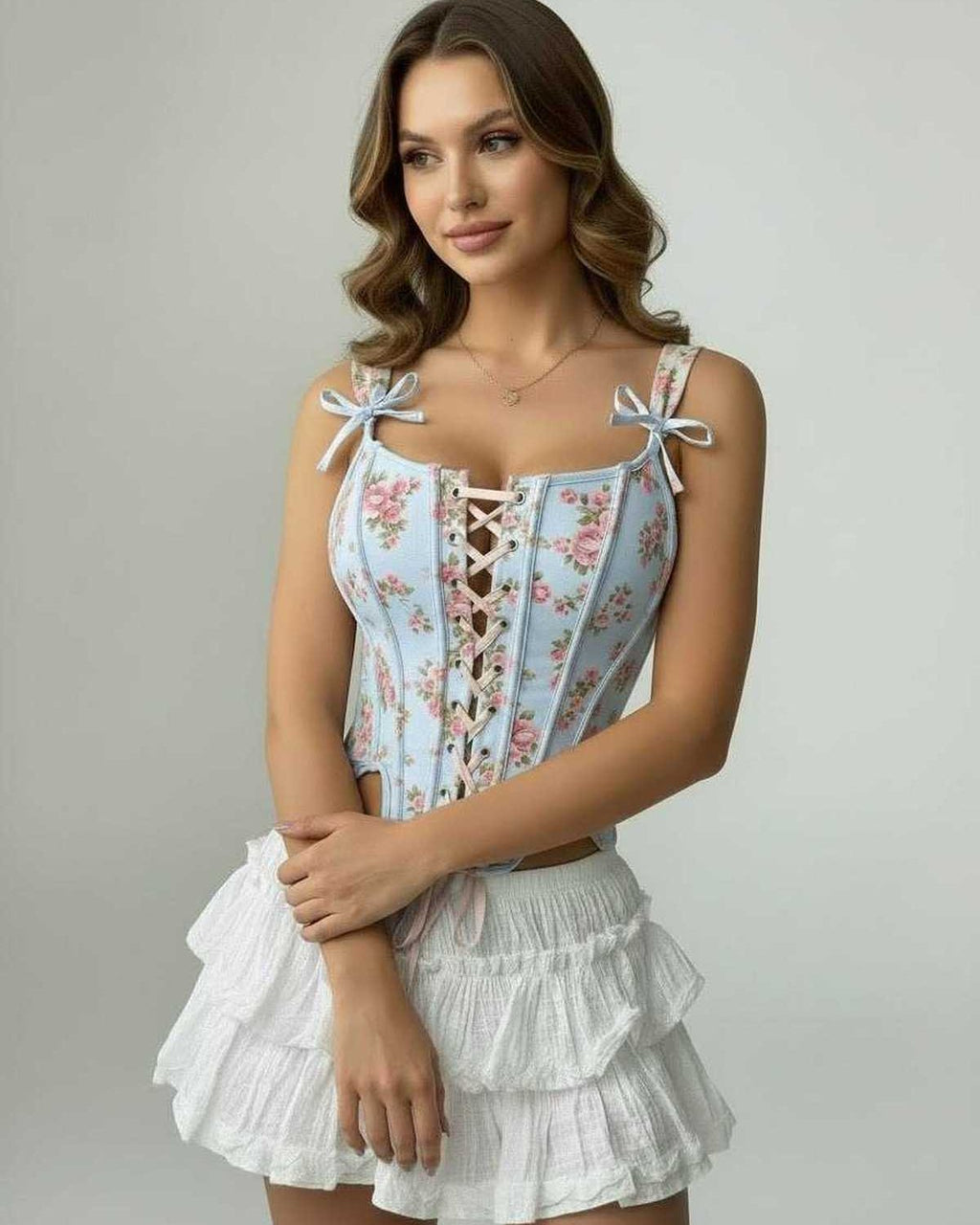 Celeste Corset Top by Lauven in blue floral design with lace-up front and structured fit, perfect for stylish outfits.