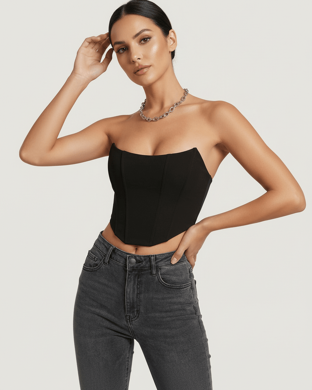Celeste Corset Top by Lauven, showcasing structured velvet elegance with defined vertical boning in a stylish black design.