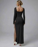 Celeste Maxi Dress by Lauven, elegant black long sleeve design with high slit, showcasing a fitted silhouette.