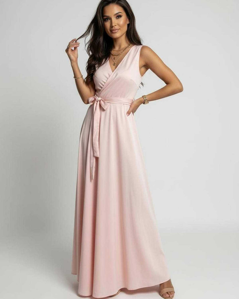 Celeste Maxi Dress by Lauven features a soft blush pink color and a timeless V-neck silhouette.