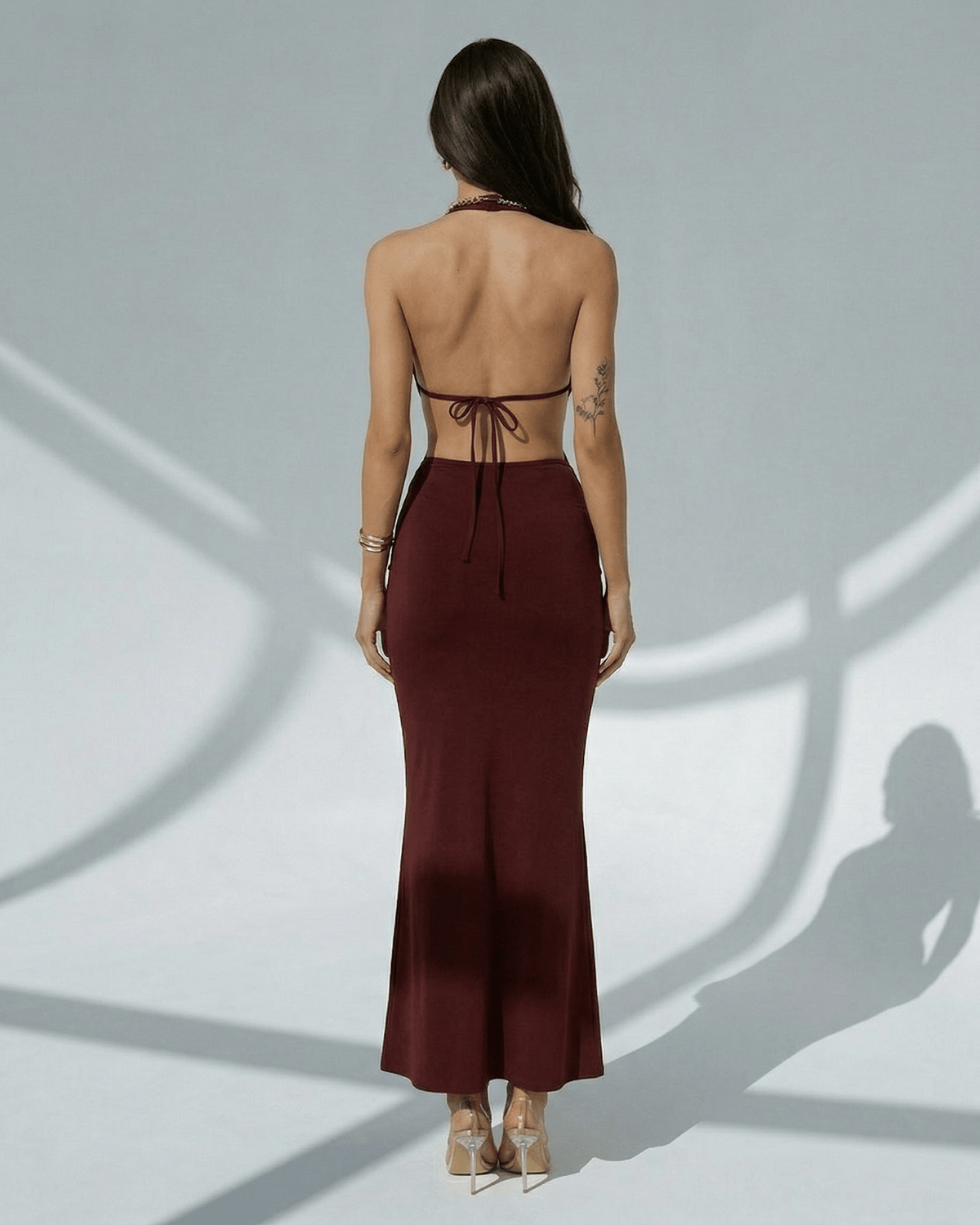 Celeste Maxi Dress back view, elegant burgundy bodycon with deep V-neck, adjustable waist by Lauven.