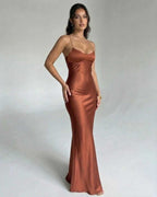 Celeste Maxi Dress by Lauven, featuring a sleek copper satin fabric and elegant V-neckline with spaghetti straps.