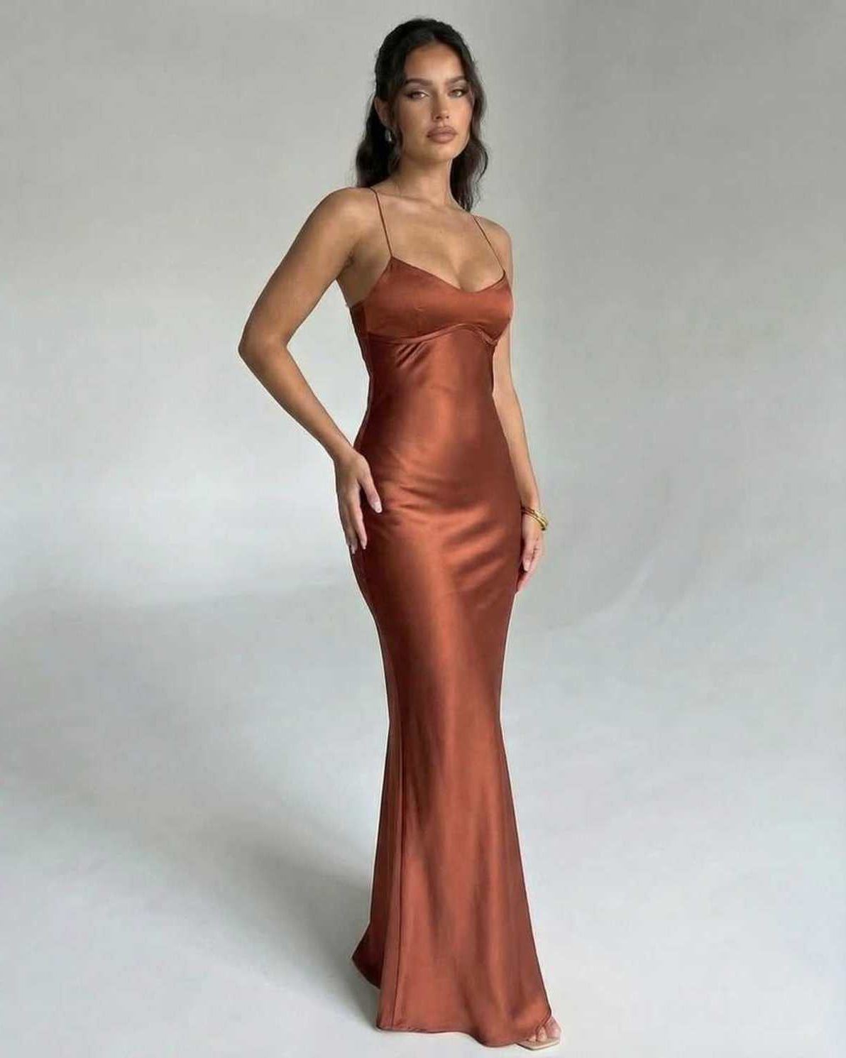Celeste Maxi Dress by Lauven, featuring a sleek copper satin fabric and elegant V-neckline with spaghetti straps.