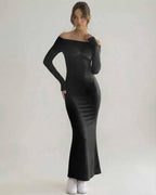 Celeste Maxi Dress - Elegant black sheath silhouette with off-shoulder design by Lauven, showcasing a modern yet timeless look.