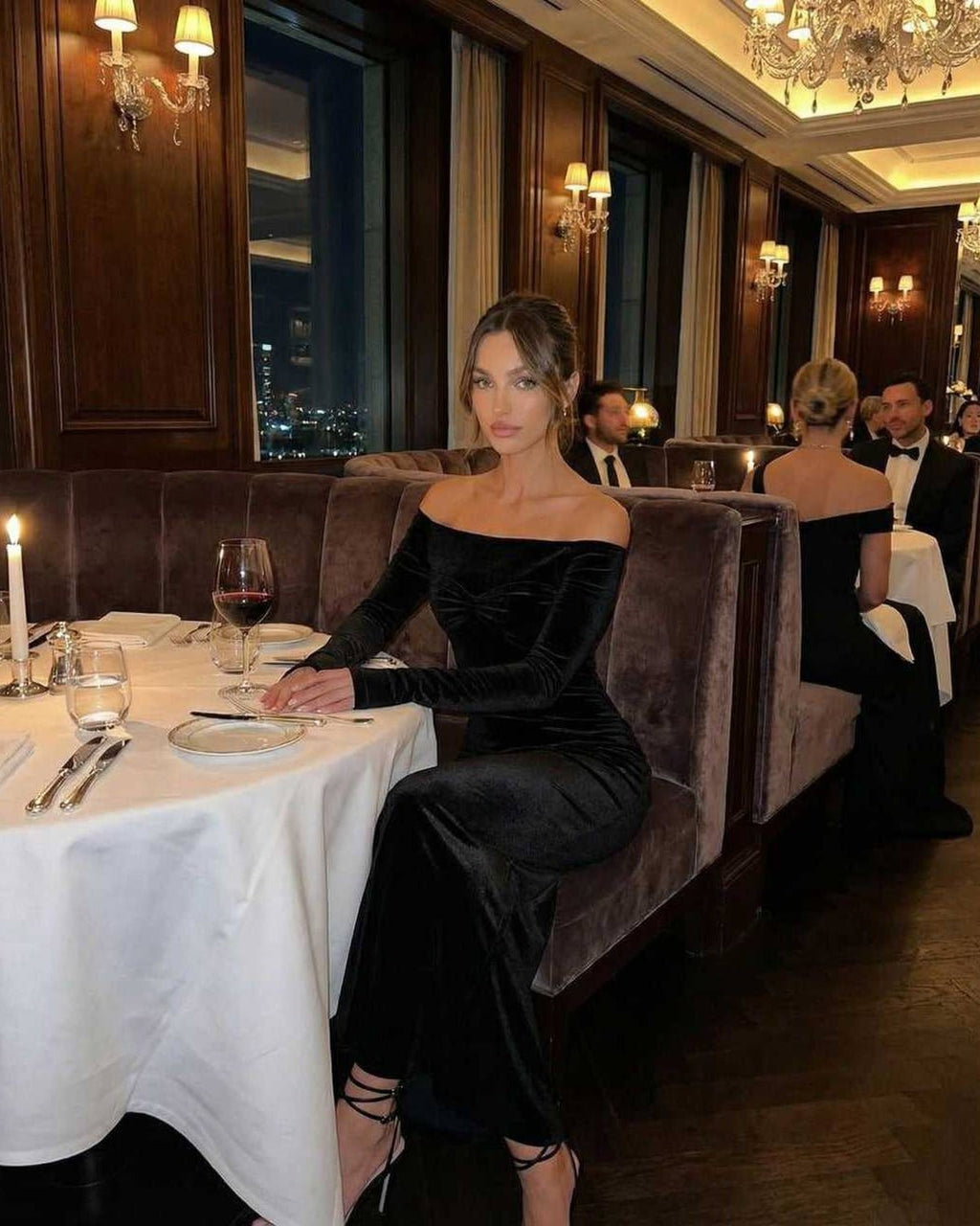 Celeste Maxi Dress worn in an elegant restaurant, showcasing its off-shoulder design, sleek silhouette, by Lauven.