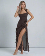 Lauven Celeste Maxi Dress featuring elegant brown sheer fabric, ruffle detailing, and a soft draped waistline.