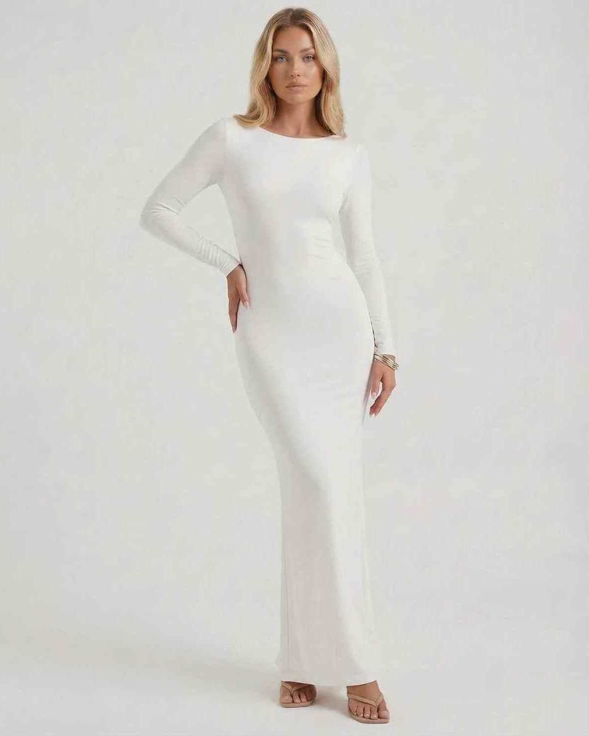 Lauven Celeste Maxi Dress, elegant white long sleeve design, open back, smooth fabric for formal occasions.