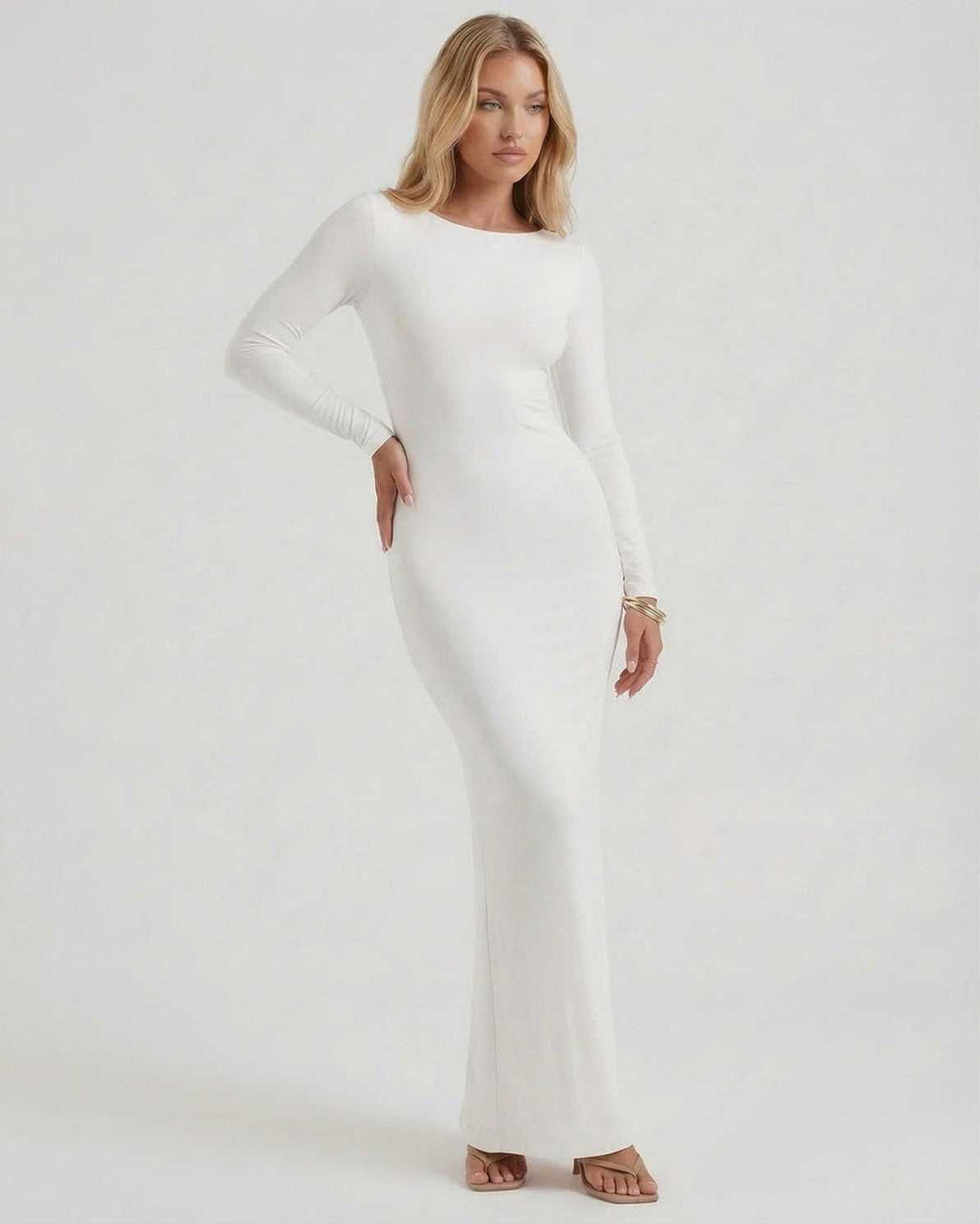 Celeste Maxi Dress by Lauven - Elegant white long sleeve dress with open back and a flattering silhouette.