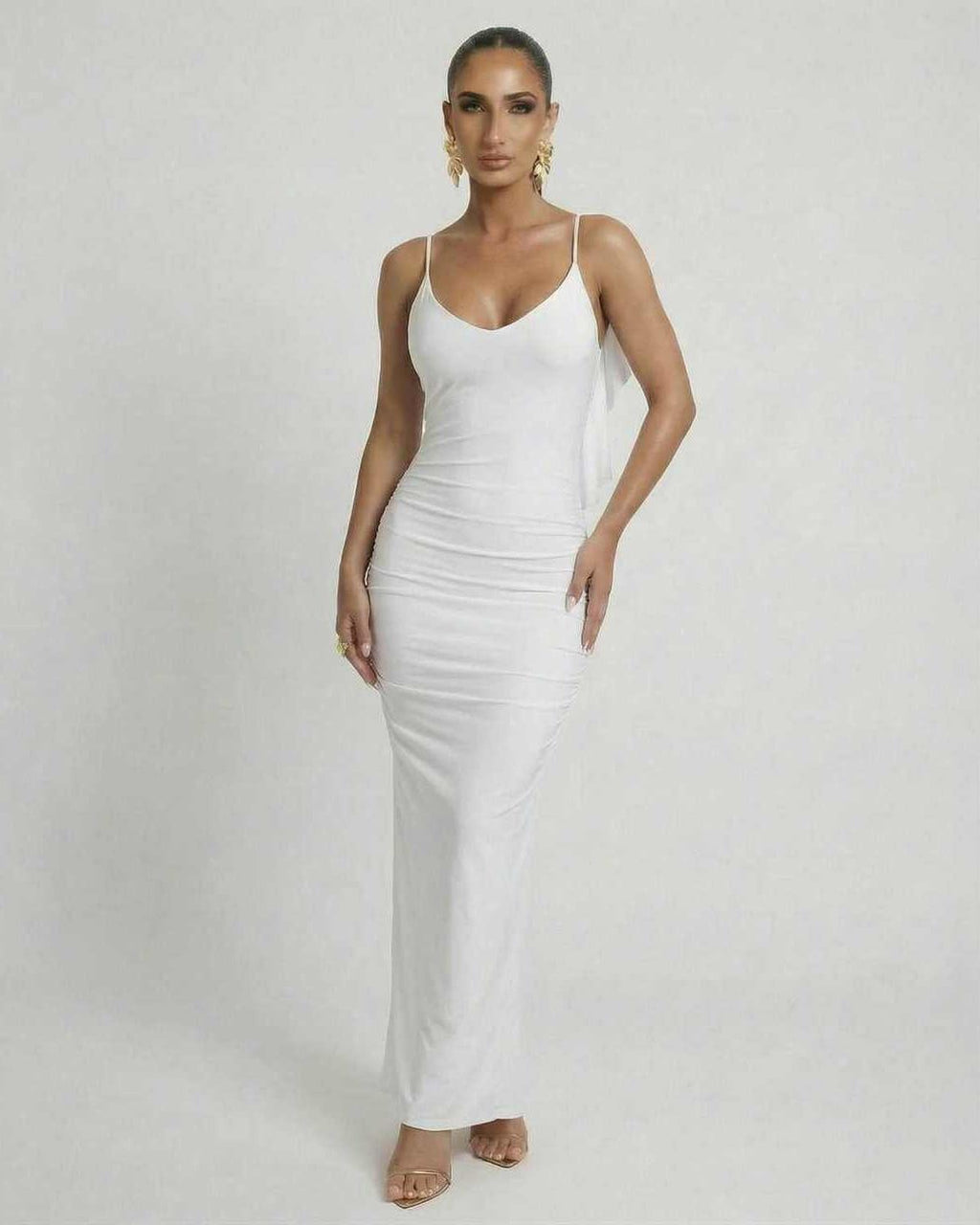Celeste Maxi Dress by Lauven, elegant white sleeveless bodycon with spaghetti straps, perfect for luxury occasions.