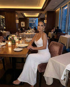 Lauven Celeste Maxi Dress – Elegant white sleeveless bodycon dress perfect for luxury occasions, showcasing a flattering silhouette.
