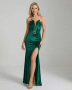 Celeste Maxi Dress by Lauven in emerald green velvet with a high slit and form-fitting silhouette.
