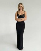 Celeste Maxi Dress by Lauven featuring a sleek lace bodice and form-fitting silhouette on a model.