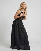 Celeste Maxi Dress by Lauven featuring an elegant halter neck and sleek black silhouette.