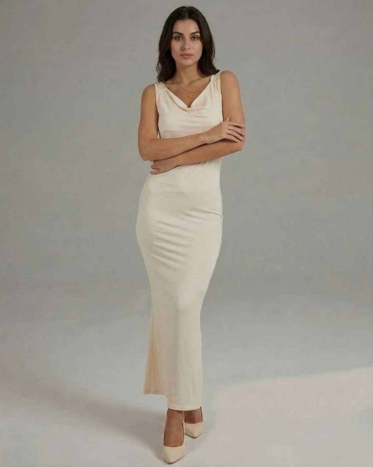 Celeste Maxi Dress – Sleek sleeveless cowl neck silhouette in solid cream by Lauven, perfect for elegant occasions.