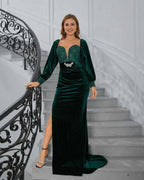 Celeste Maxi Dress by Lauven worn by a model, featuring a deep green velvet design and elegant sequin detailing.