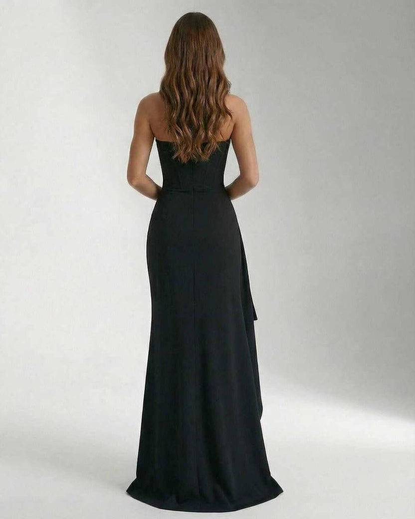 Back view of the Celeste Maxi Dress by Lauven, featuring a sleek and elegant strapless design and thigh-high slit.