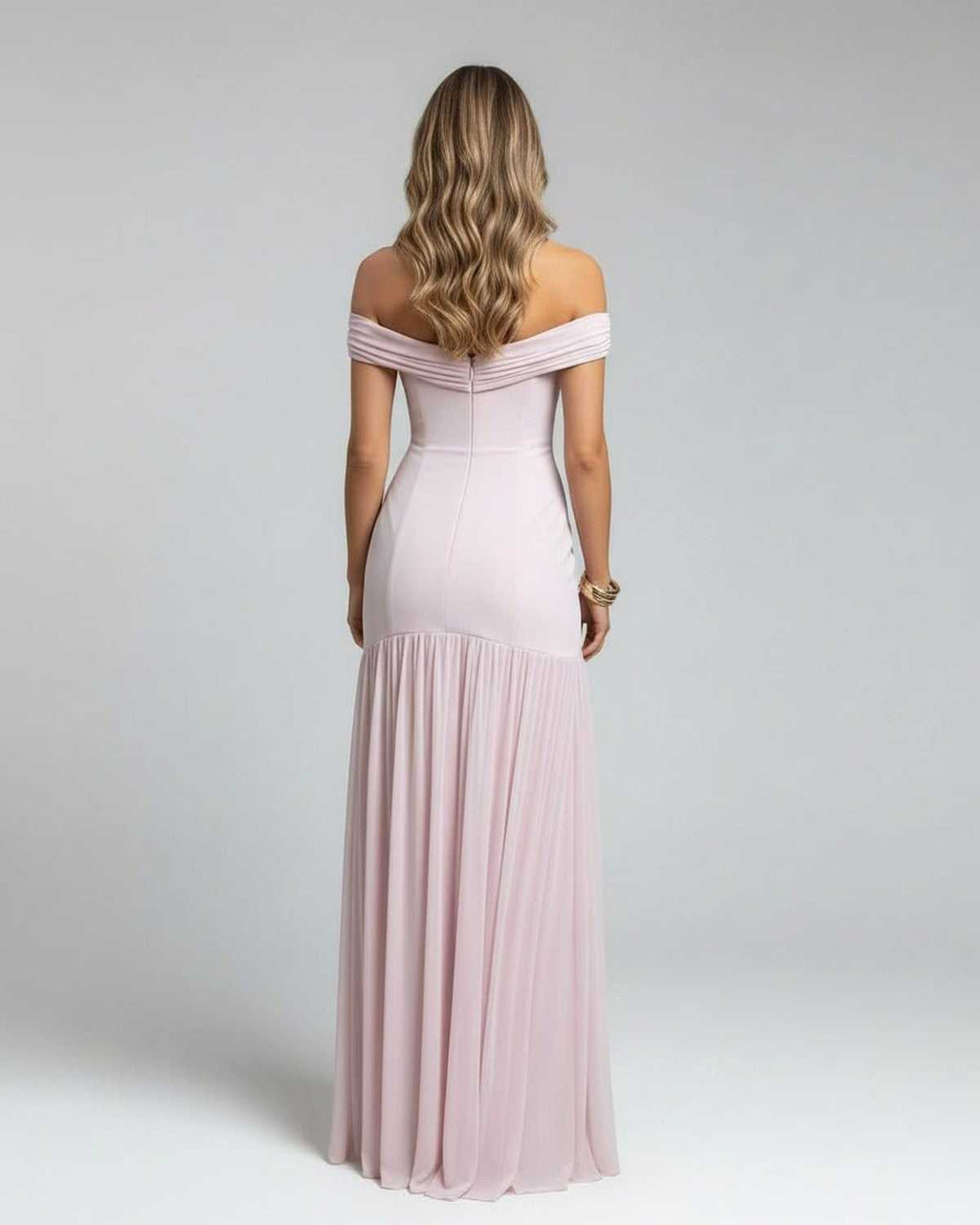 Back view of Celeste Maxi Dress by Lauven, an elegant off-shoulder evening gown in soft pink with flowing skirt.