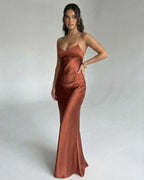 Elegant Celeste Maxi Dress by Lauven in rich copper tone, featuring satin fabric and a sleek silhouette.