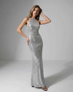 Celeste Maxi Dress featuring silver sequins, halter neck, and elegant silhouette by Lauven, perfect for evening parties.