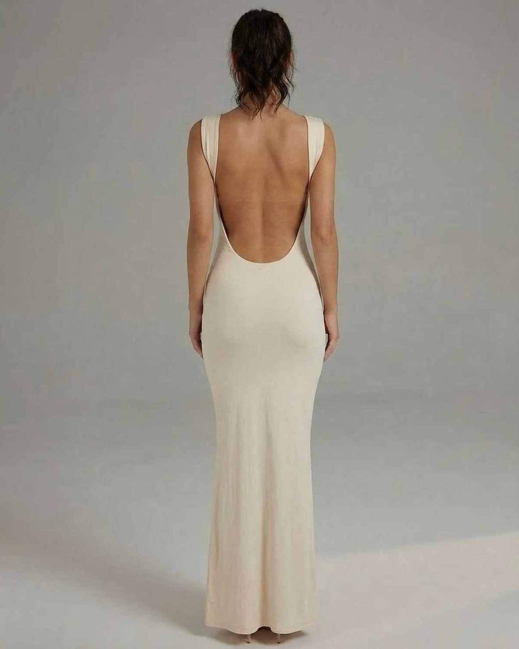 Celeste Maxi Dress - Sleek sleeveless design with backless detail, elegant cream color by Lauven.