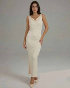 Celeste Maxi Dress - Elegant sleeveless cowl neck dress by Lauven, featuring a smooth cream fabric and sleek silhouette.