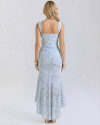Celeste Maxi Dress by Lauven showcasing the elegant back view with a pleated design and fish tail hemline in pale blue.