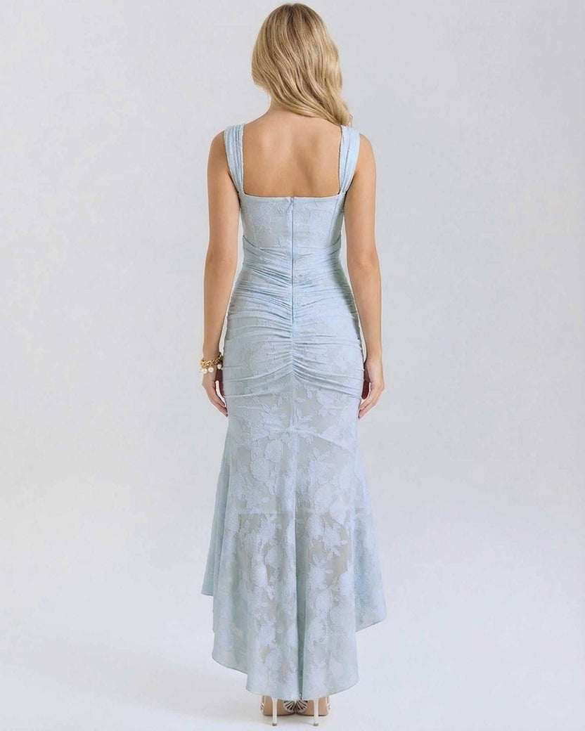 Celeste Maxi Dress by Lauven showcasing the elegant back view with a pleated design and fish tail hemline in pale blue.