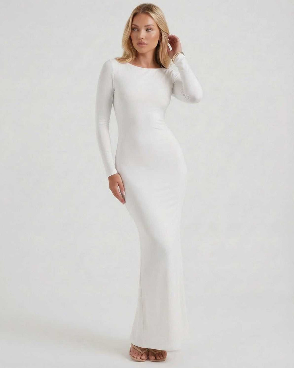 Celeste Maxi Dress by Lauven, elegant white long sleeve dress with open back and sleek fit, perfect for formal occasions.