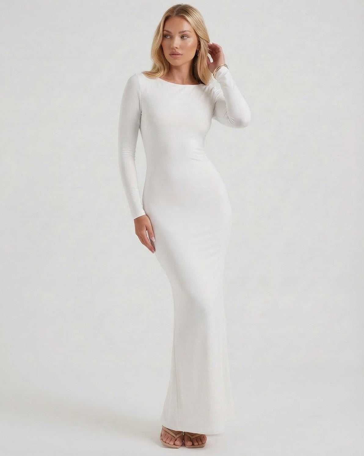 Celeste Maxi Dress by Lauven, elegant white long sleeve dress with open back and sleek fit, perfect for formal occasions.