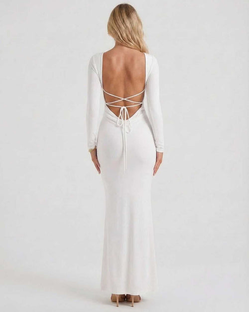 Celeste Maxi Dress by Lauven, elegant white long sleeve dress with open back, showcasing a sleek silhouette.