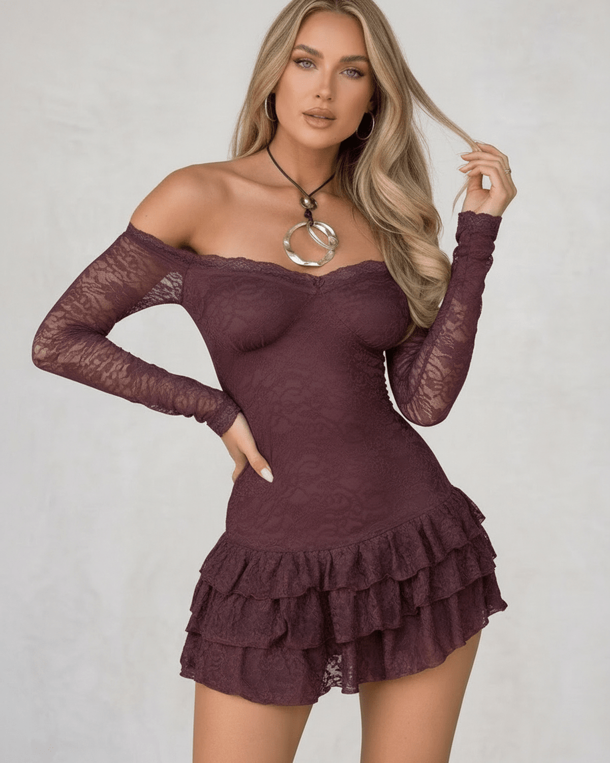 Celeste Mini Dress by Lauven in deep plum lace with ruffled hem and sheer long sleeves.