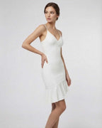 Celeste Mini Dress by Lauven featuring a chic white A-line silhouette with ruffle detail.