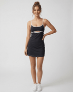Celeste Mini Dress by Lauven featuring a sleek cut-out detail and black design with white trim accents.
