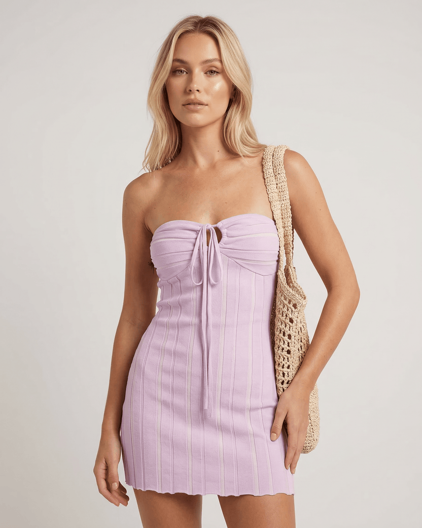 Celeste Mini Dress by Lauven in soft lavender hue, showcasing a sleek knitted fabric with vertical ribbing.