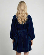 Celeste Mini Dress back view showing navy velvet fabric, long sleeves, and relaxed silhouette by Lauven.