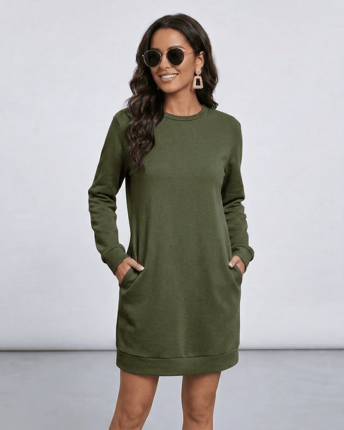 Model wearing Celeste Mini Dress by Lauven in olive green with pockets, showcasing casual style.