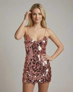 Celeste Mini Dress by Lauven features a shimmering rose gold sequin finish and a sleek bodycon silhouette.