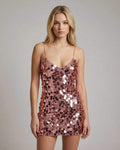 Celeste Mini Dress by Lauven, a rose gold sequin bodycon mini dress with spaghetti straps and V-neckline.