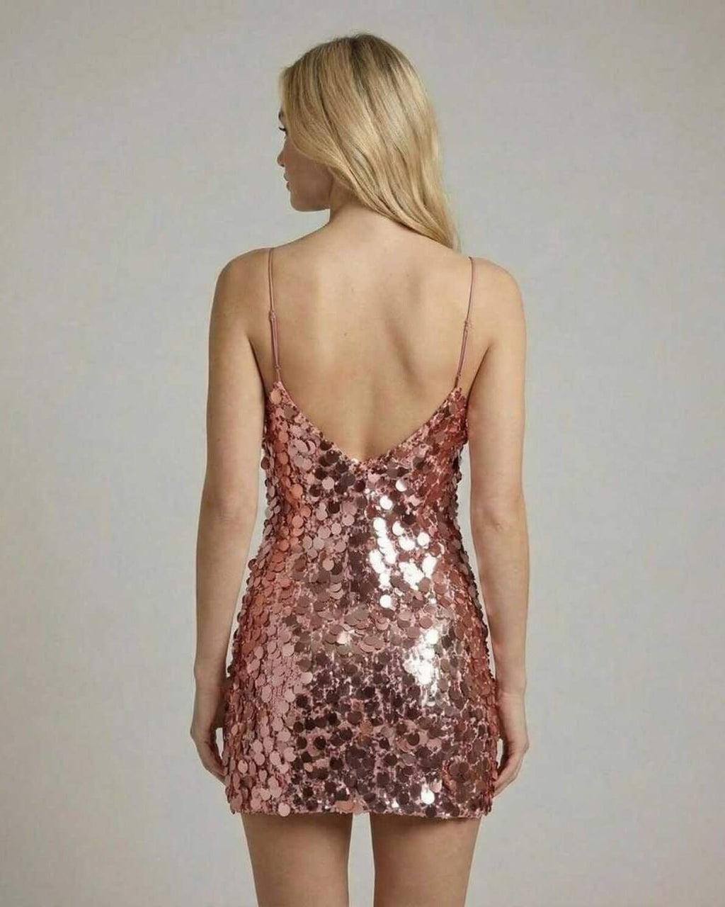 Celeste Mini Dress by Lauven, rose gold sequin bodycon mini dress showcasing a sleek back view.