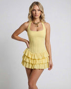 Celeste Mini Dress by Lauven featuring a tiered ruffle skirt in soft yellow, perfect for playful and refined occasions.