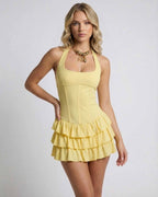 Celeste Mini Dress by Lauven in soft yellow with tiered ruffle skirt, sleeveless design for a fresh, modern look.