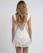 Celeste Mini Dress by Lauven, showcasing a stunning white lace back design and spaghetti straps for a stylish look.