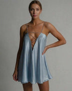 Beautiful model wearing the Celestial Mini Dress by Lauven, featuring satin A-line silhouette in icy blue.