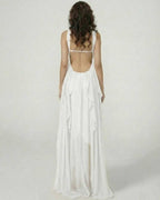 Back view of a model wearing the Clariona Maxi Dress by Lauven, showcasing ruffle details and a flowing silhouette.