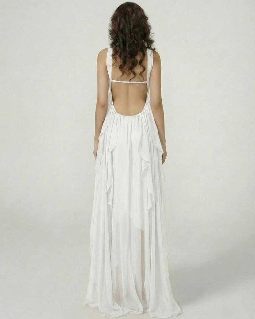 Back view of a model wearing the Clariona Maxi Dress by Lauven, showcasing ruffle details and a flowing silhouette.